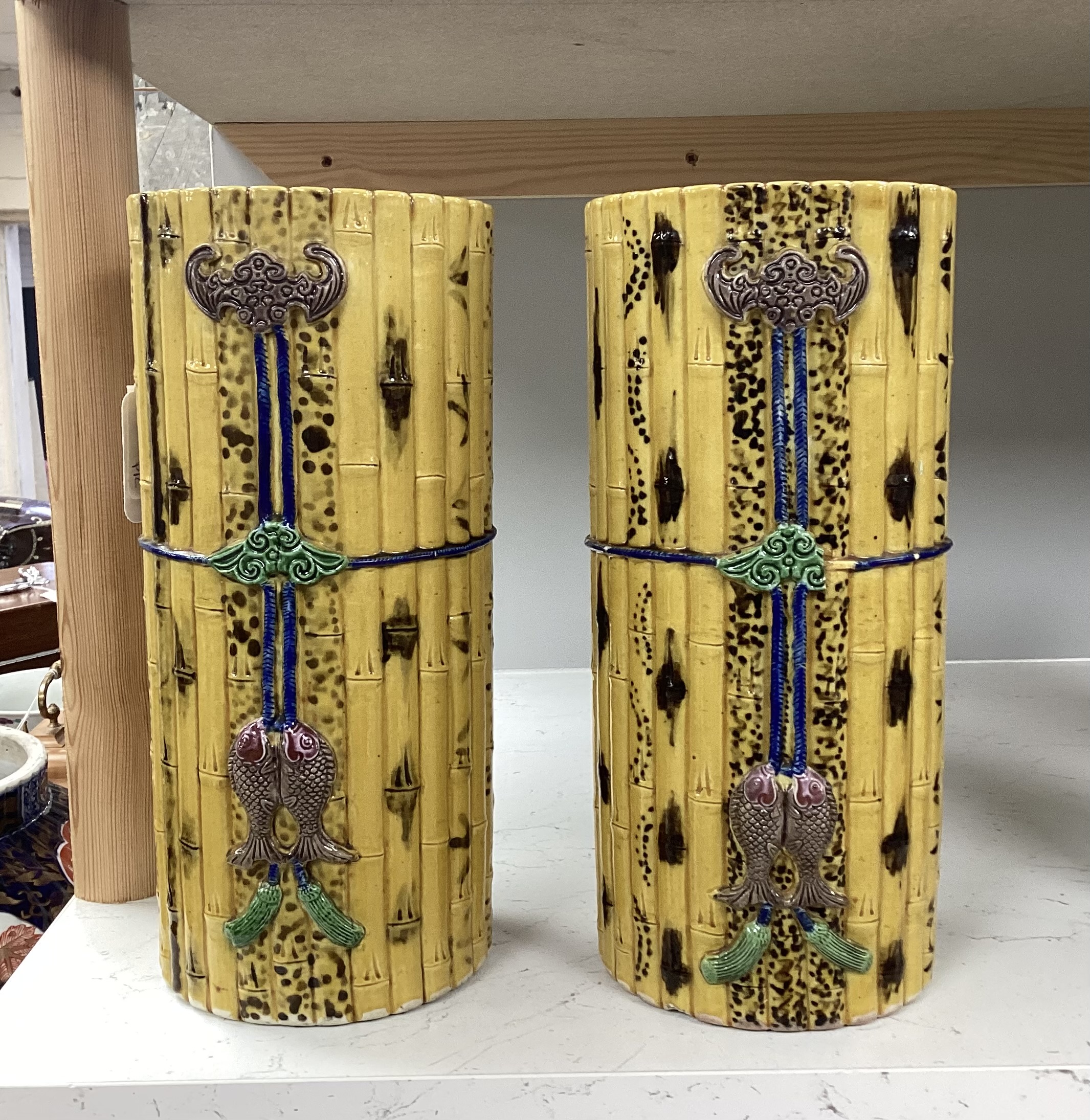 A pair of Chinese polychrome glazed faux bamboo vases, 19th century, 27cm high